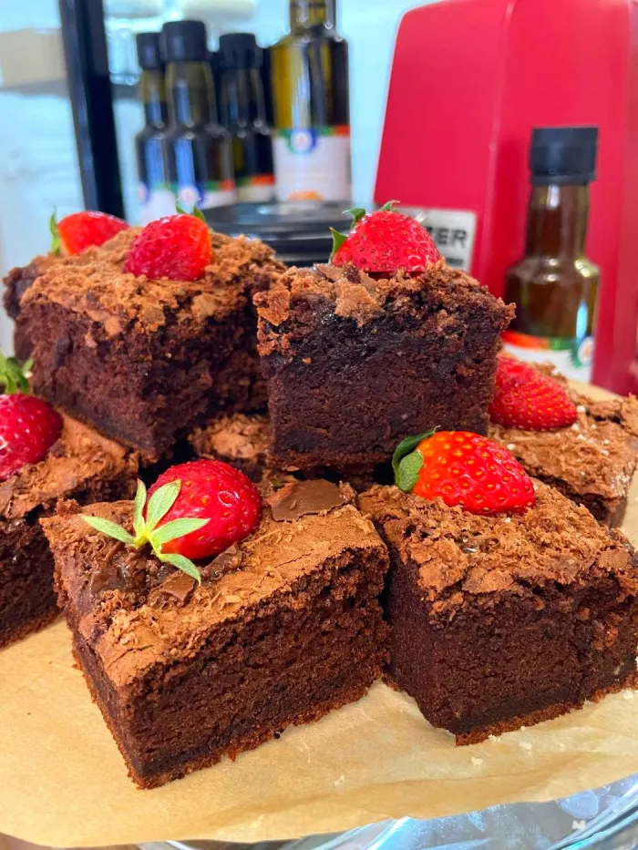 Chocolate brownie squares topped with fresh strawberries in Sandanski cafe