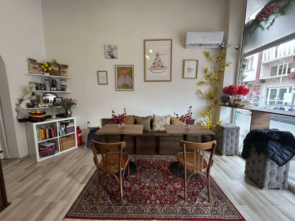 Interior of Panna Cotta restaurant in Sandanski with seating area by the window