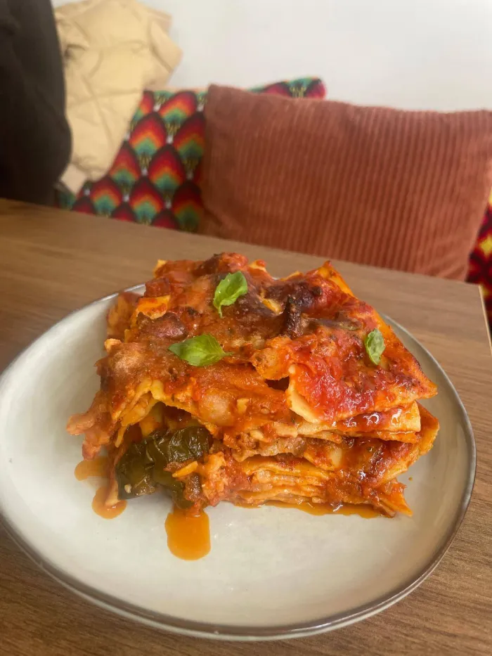 Homemade lasagna with tomato sauce and basil served at Panna Cotta restaurant in Sandanski